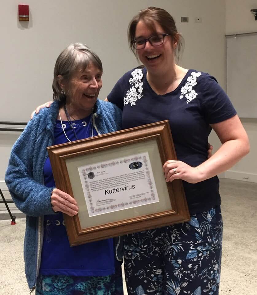 Betty Kutter receives a certificate